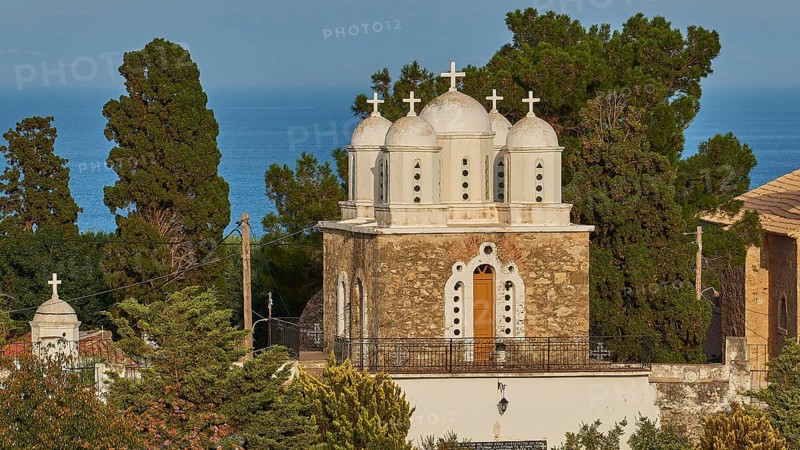 Frontal view of a church with white domes and a bell tower against a blue sky, Koroni, Byzantine fortress, nunnery, Peloponnese, Greece, Europe