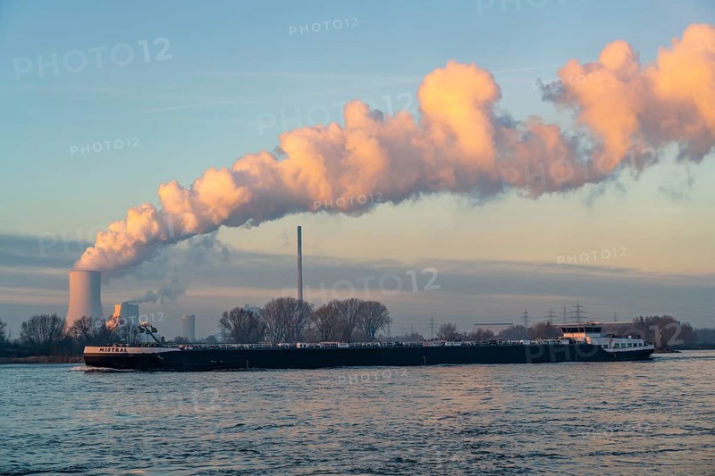 Cooling tower of the coal-fired power plant Duisburg-Walsum, operated by STEAG and EVN AG, 181 metres high, power plant unit 10, water vapour cloud, container cargo ship on the Rhine, Duisburg, North Rhine-Westphalia, Germany, Europe