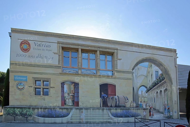Mural by artist group 7e Sens, 2021 with historical city history, street art, mock architecture, mock painting, former railway station, Valréas, Valreas, Vaucluse, Provence, France, Europe