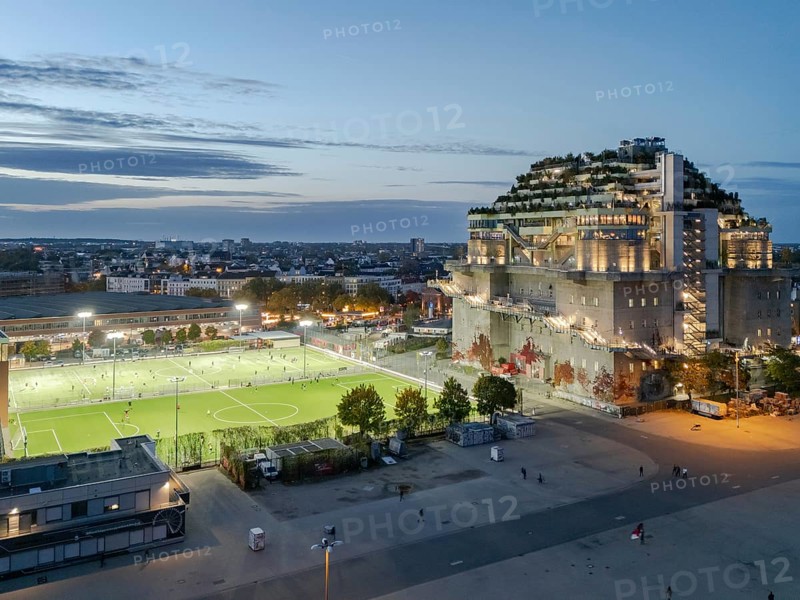 Aerial view of the Hamburg Bunker with green terraces and modern architecture in the evening cityscape at the blue hour, Heiligengeistfeld, St. Pauli, Altona, Hamburg, Germany, Europe