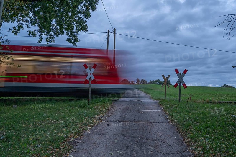 Passing Gräfenberg railway, single-track branch line, at the unrestricted level crossing, Igensdorf, Upper Franconia, Bavaria, Germany, Europe