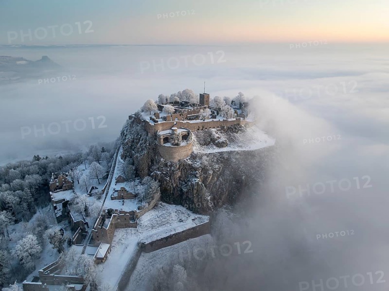 Aerial view of the Hegau volcano Hohentwiel with Germany's largest fortress ruins on a cold, foggy winter morning, in front of sunrise, on the horizon the Hohenkrähen, Singen am Hohentwiel, district of Constance, Baden-Württemberg, Germany, Europe