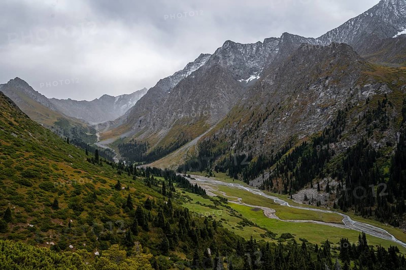 Green mountain valley with river and steep mountain peaks, Chong Kyzyl Suu Valley, Terskey Ala Too, Tien-Shan Mountains, Kyrgyzstan, Asia