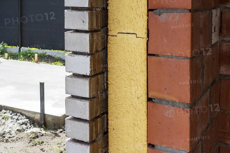 Close up of cavity wall insulation boards fitted in masonry cavities in newly built house used to reduce heat loss