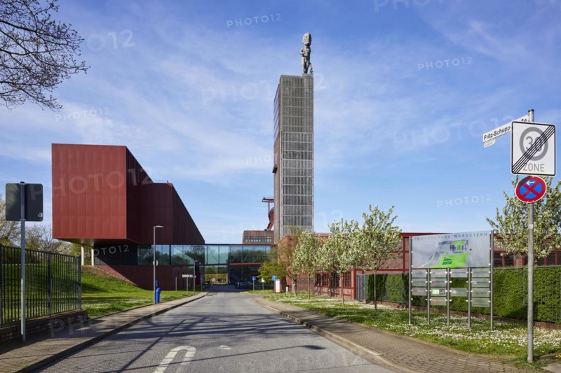 Entrance to the Nordstern industrial park with Fritz-Schupp-Straße, winding tower of the former Nordstern colliery and Hercules statue in Nordsternpark, Gelsenkirchen, Ruhr area, independent city, North Rhine-Westphalia, Germany, Europe