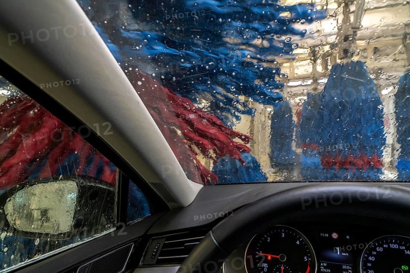 Car in an automatic car wash, car wash tunnel