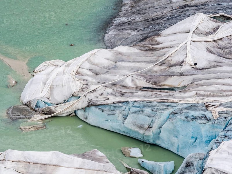 Rhone glacier covered with sheets to protect the ice from melting above the glacier cave, Belvedere, Switzerland, Europe