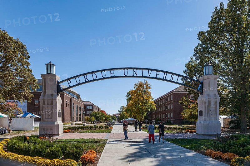 Students under Gateway to the Future arch on the campus of Purdue University in West Lafayette, Indiana, USA, North America