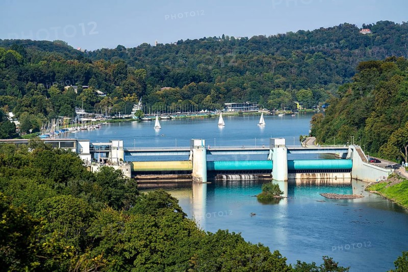 Lake Baldeney, a Ruhr reservoir, dam wall, with hydroelectric power plant power station, behind the regatta tower with grandstands, in Essen, North Rhine-Westphalia, Germany, Europe