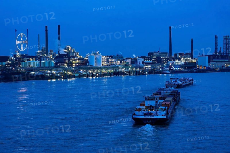 Backdrop of Chempark Leverkusen, Bayer Leverkusen, chemical park, chemical plant, river Rhine, cargo ship, Leverkusen, North Rhine-Westphalia, Germany, Europe