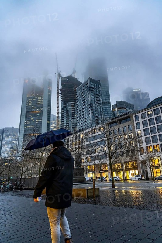 Rainy weather, freezing rain, Goetheplatz, high-rise skyline in clouds, passers-by hurrying through the damp, icy weather, Frankfurt am Main, Hesse, Germany, Europe