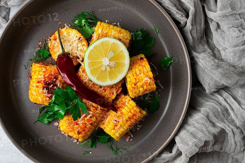 Grilled corn with spices, top view, no people, homemade