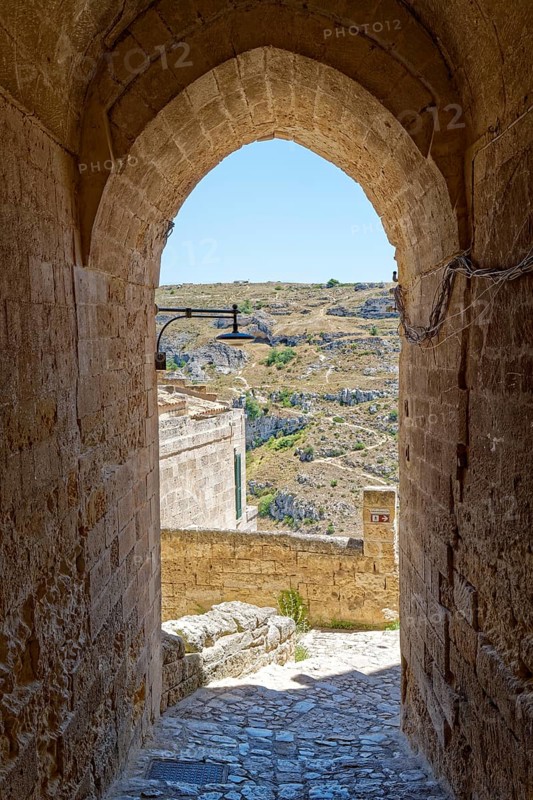 Paths and corridors in the tuff of the Sassi Barisano in the cave town of Matera. The cave settlements, Sassi, are a UNESCO World Heritage Site. Matera, Basilicata, Southern Italy, Southern Europe