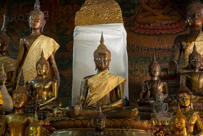 Numerous Buddhas and the city pillar, which is considered the home of the city's protective spirit, Wat Si Muang temple complex, Vientiane, Laos, Asia