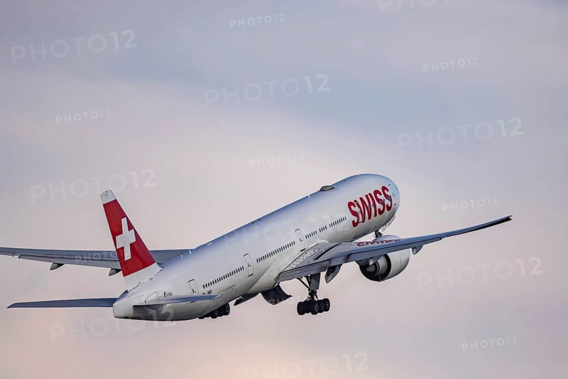 Aircraft taking off at Zurich Airport. Registration: HB-JNK, airline SWISS, BOEING 777-300ER. Zurich, Switzerland, Europe