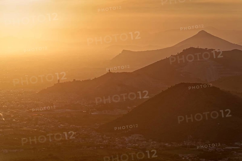 View of the densely populated Neapolitan region and the mountains near Caserta in the hazy light of the evening sun. San Felice a Cancello, Caserta, Campania, Italy, Southern Europe, Europe