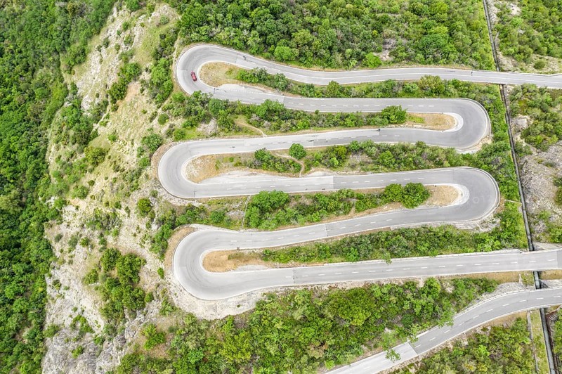 Aerial view, drone shot, Mountain pass road with multiple hairpins, water pipeline, Switzerland, Europe