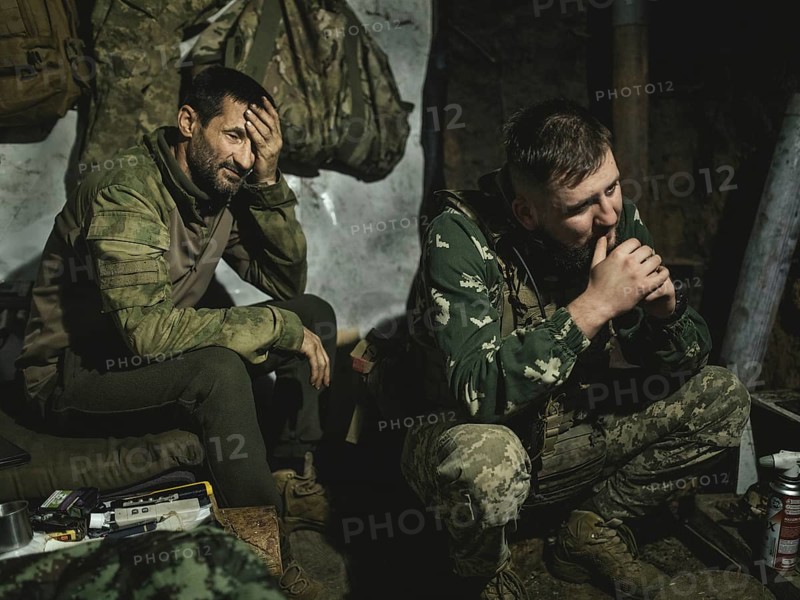Iura waits with his comrade Volodymyr in a position with a 122 mm artillery gun from Soviet stocks for the order to deploy. Normally they are in the position for a month. This time, however, they have been waiting longer for relief, near Kupyansk, Ukraine, 2024, Europe