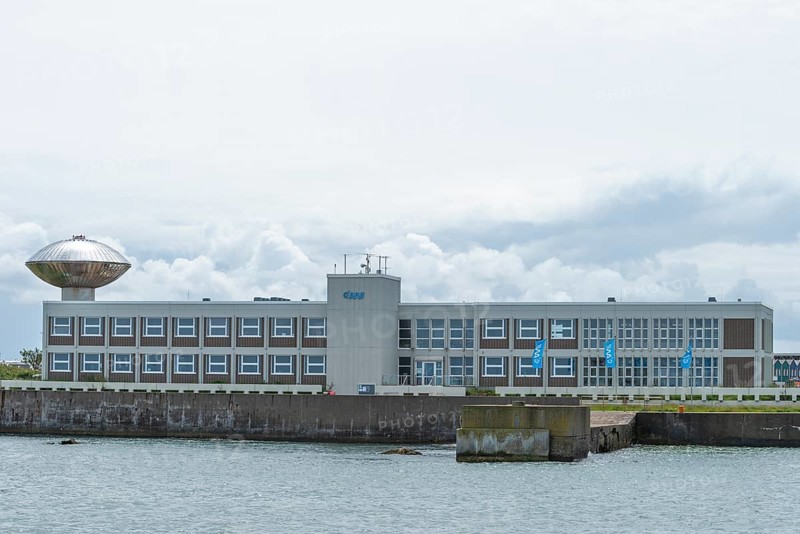 AWI, Alfred Wegener Institute, flags, architecture, research, tower of the reef fauna lobster breeding station, pier, offshore island of Heligoland, North Sea, Pinneberg district, Schleswig-Holstein, Germany, Europe