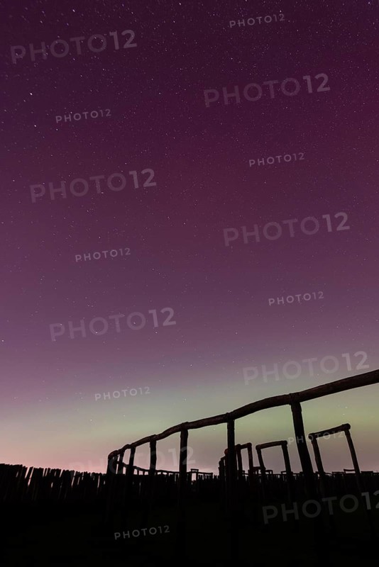 Northern lights (aurora borealis) over the ring sanctuary of Pömmelte, prehistoric circular ditch complex, also known by archaeologists as the German Stonehenge, Pömmelte, Saxony-Anhalt, Germany, Europe