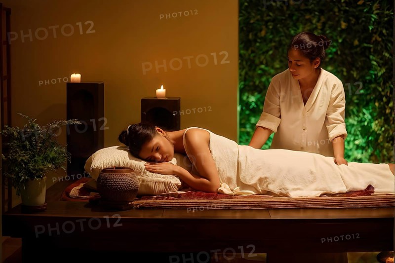 Person blissfully indulges in a tranquil massage in ambient candlelight, AI generated