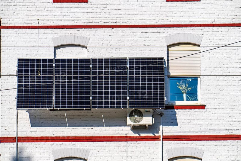 Solar system on the exterior wall of a residential building