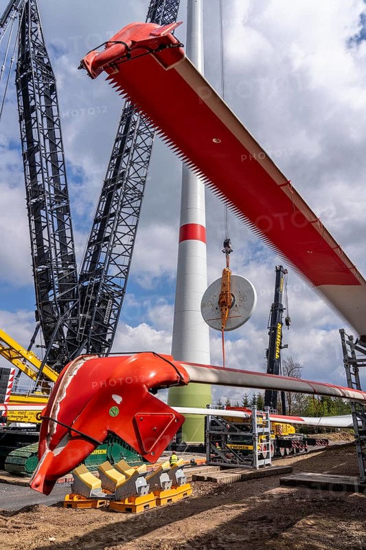 Erection of a wind turbine, wind energy plant, assembly of the ring generator, with a crawler lattice crane, wind farm near Hagen, North Rhine-Westphalia, Germany, Europe