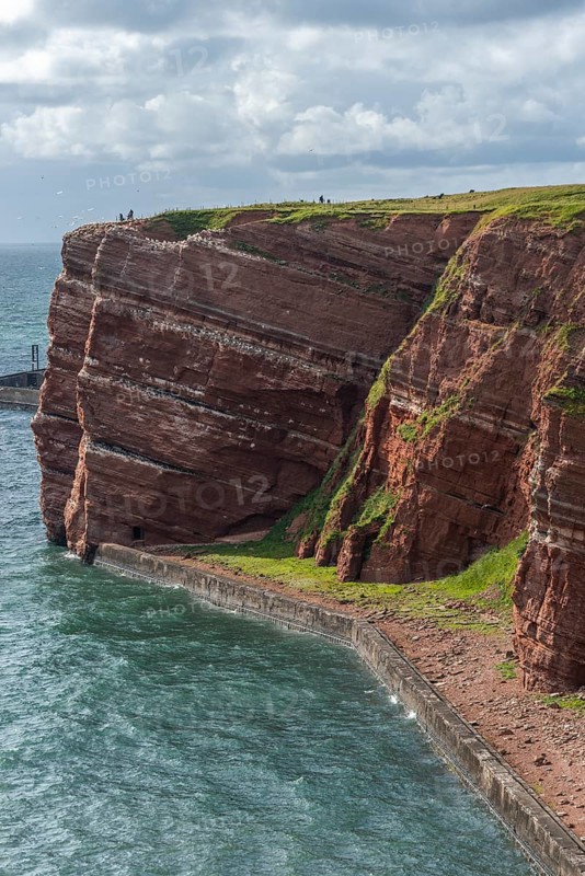 Red coloured sandstone, steep cliff coast of the offshore island of Heligoland, home of the gannets, Helgoländer Oberland, North Sea, Pinneberg district, Schleswig-Holstein, Germany, Europe