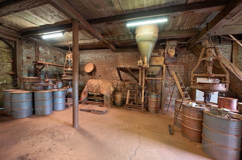 Metal barrels in the bronze powder filling room of a metal powder mill, founded in 1900, Igensdorf, Upper Franconia, Bavaria, Germany, Europe