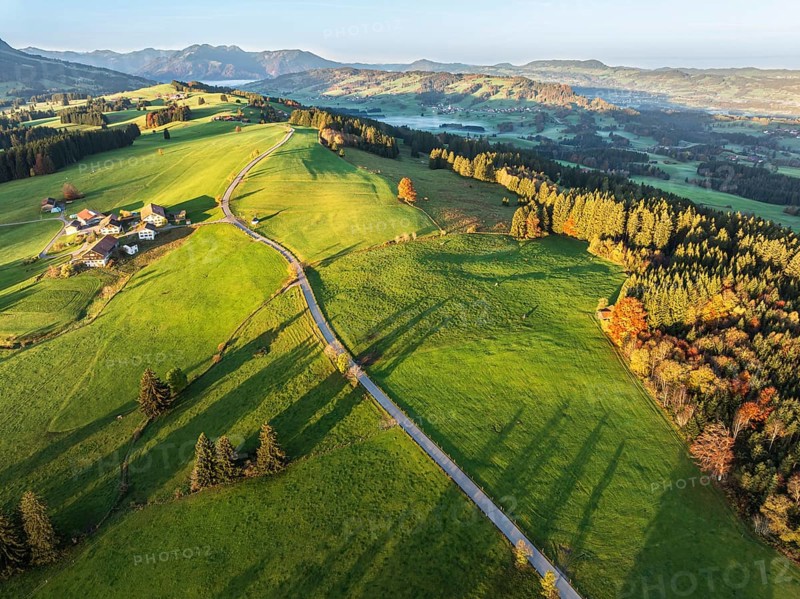 Mountain range near village Wertach, old farm, sunrise, fog in valley, traditional farm, autumn colors, aerial view, Allgaeu, Bavaria, Germany, Europe