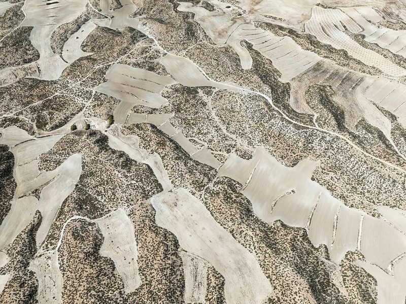 Farmland amongst rocky outcrops. Aerial view. Drone shot. Granada province, Andalusia, Spain, Europe