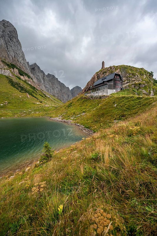 Wolayersee and Alpine Club hut Wolayerseehütte, rocky cloudy mountains, Carnic Alps, Carnic High Trail, Carinthia, Austria, Europe