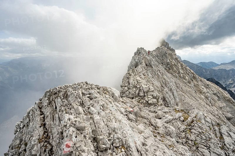 Clouds around a narrow rocky ridge, Watzmann crossing to Watzmann Mittelspitze, view of mountain panorama, Berchtesgaden National Park, Berchtesgaden Alps, Bavaria, Germany, Europe