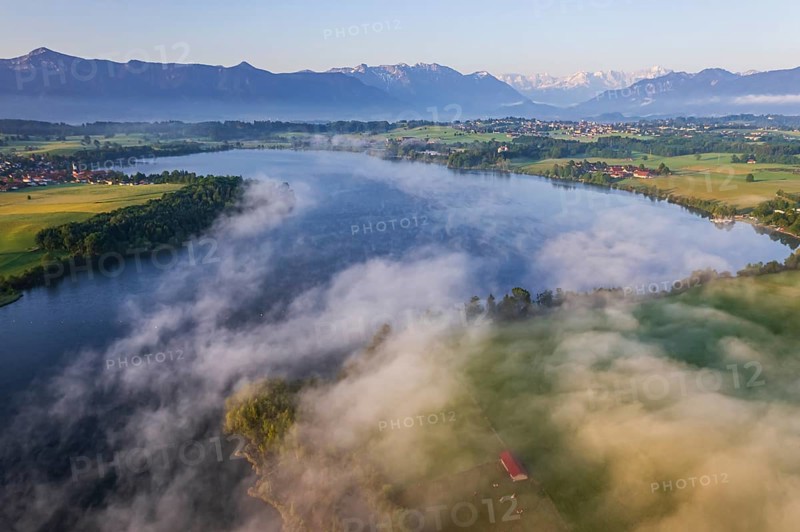 Aerial view of a lake in front of mountains in the morning light, fog, summer, Riegsee, view of Estergebirge, Murnau and Zugspitze, Alpine foothills, Upper Bavaria, Bavaria, Germany, Europe