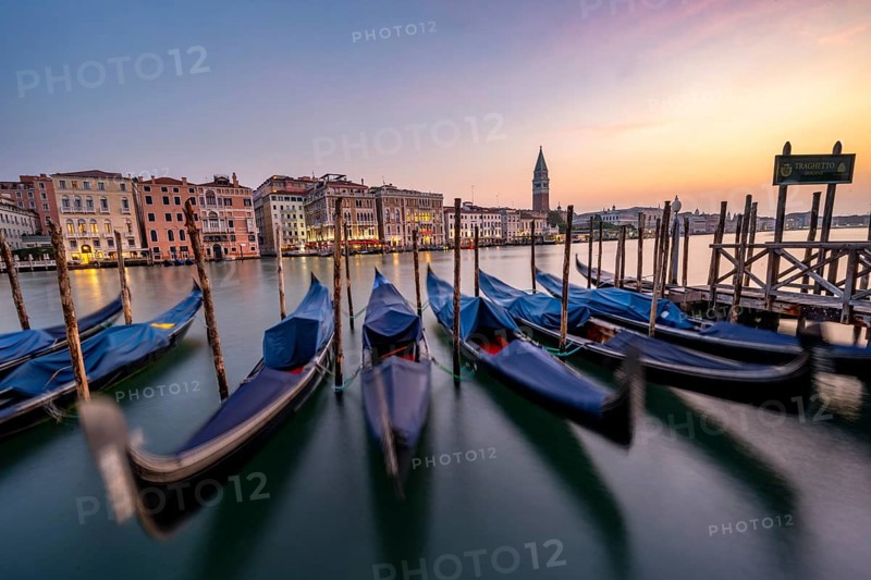 Venetian gondolas, boat dock at the customs office on the Grand Canal, Gondola Traghetto Dogana, Campanile behind, long exposure at sunrise, Venice, Veneto, Italy, Europe