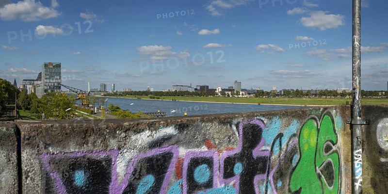 Panorama from the graffiti painted south bridge over the southern Rheinau harbour, the Rhine and the Deutz district on the right bank of the Rhine, Cologne, Rhineland, North Rhine-Westphalia, Germany, Europe