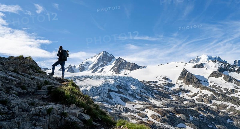 Mountaineer in front of high alpine mountain landscape, summit of the Aiguille de Chardonnet and Glacier du Tour, glacier and mountain peak, Chamonix, Haute-Savoie, France, Europe