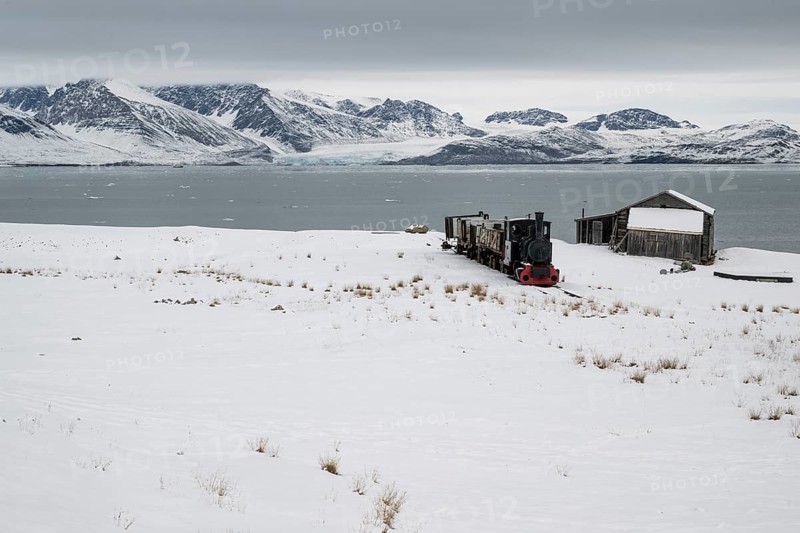 Historic mine railway in winter landscape, Kongsfjord, Ny-Ålesund, Spitsbergen Island, Svalbard and Jan Mayen archipelago, Norway, Europe