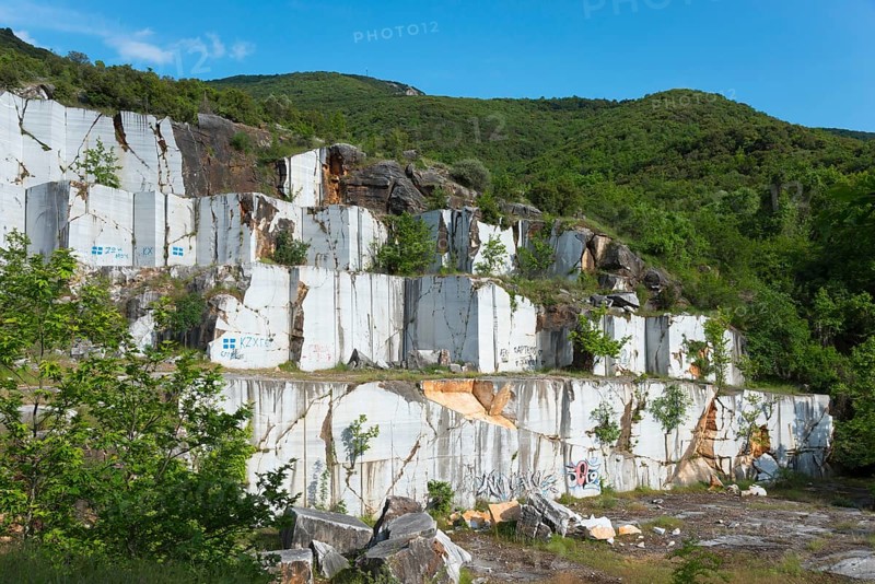 Abandoned quarry with white rock walls surrounded by trees, Kavala, Dímos Kaválas, Eastern Macedonia and Thrace, Greece, Europe