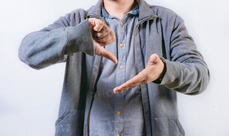 Unrecognizable person talking in sign language isolated. Interpreter gesturing in sign language isolated