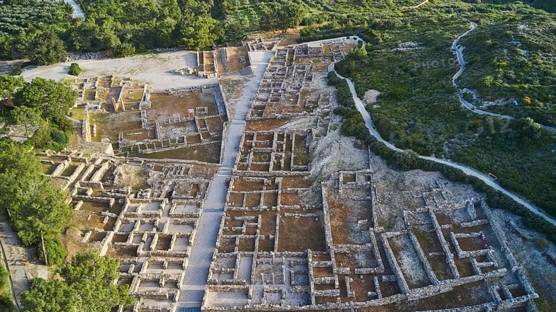 Drone shot, first morning light, aerial view of an ancient site, remains of walls and structures amidst green vegetation, Kamiros, archaeological site, ancient city, foundation of Doric Greeks, Rhodes, Dodecanese, Greek Islands, Greece, Europe