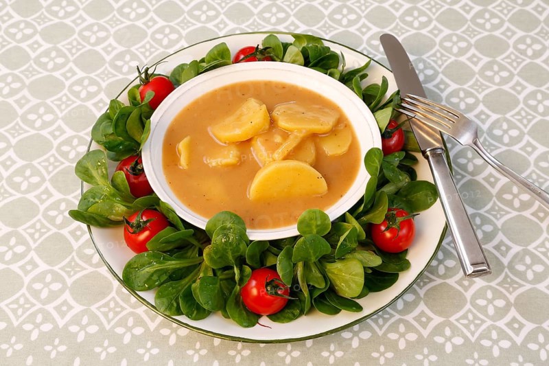 Swabian cuisine, sour potato wheels, potato slices in sour sauce, healthy cuisine, typical Swabian, home cooking, traditional cuisine, food photography, studio