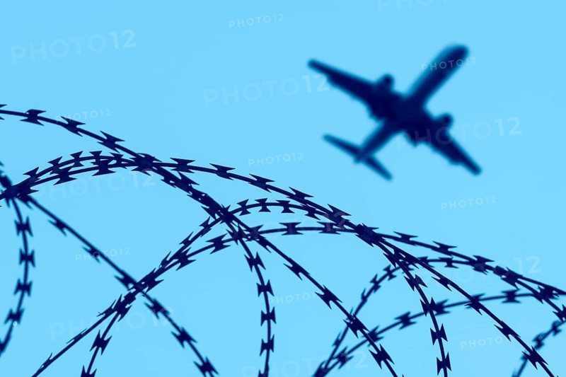 Symbolic image, deportation flights of illegal and delinquent migrants, passenger aircraft, airport, security fence, barbed wire, Germany, Europe
