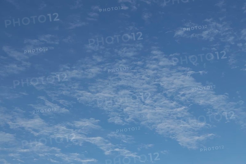 Altostratus white clouds in a blue sky, England, United Kingdom, Europe