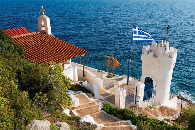 Small chapel with Greek flag and sea view, Church of Agios Nikolaos Krasoktistos, Agia Kyriaki, Nafplio, Nauplia, Nauplion, Nafplion, Argolis, Argolic Gulf, Peloponnese, Greece, Europe