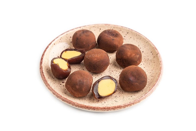 Japanese rice sweet buns chocolate mochi filled with cream isolated on white background. side view, close up