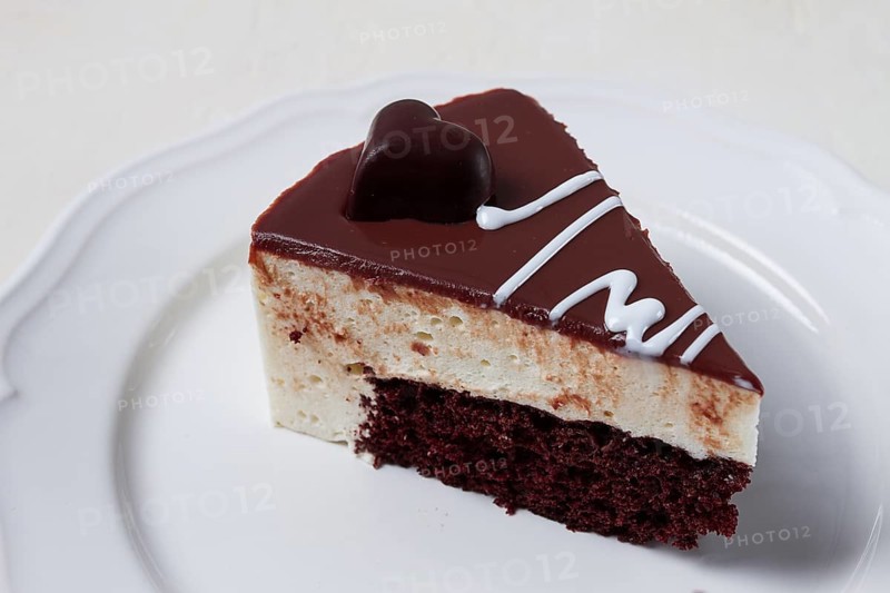 Slice of cake, bird's milk, chocolate sponge cake with souffle, sweet dessert, on a white plate, close-up, horizontal, no people