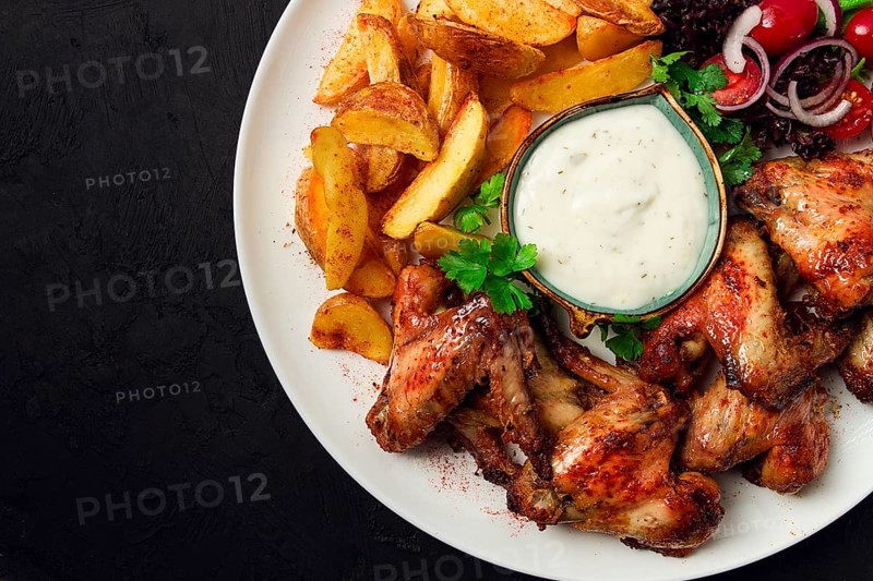 Fried chicken wings, with potatoes, and spices, homemade, fast food, no people