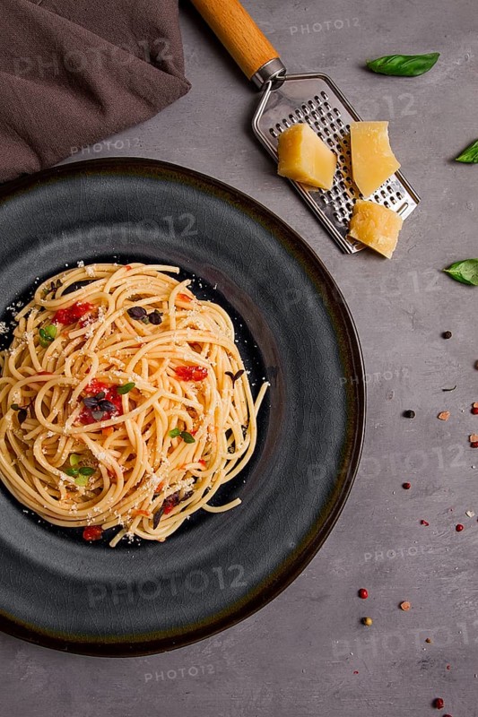 Pasta with tomato sauce and cheese, Italian traditional dish, close-up, no people