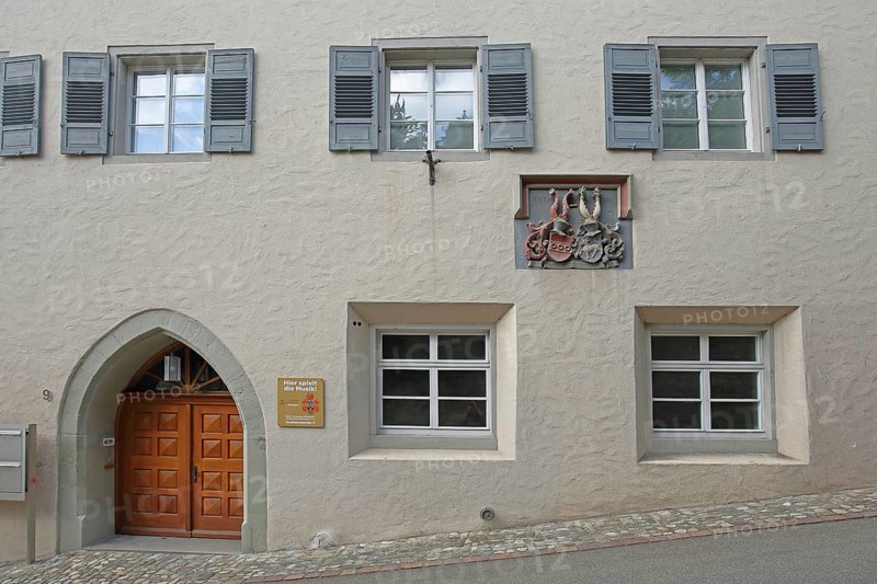 House wall with grey shutters of the music school built in the 16th century with coat of arms of Reichlin von Meldegg, noble family, Überlingen, Überlinger See, Lake Constance area, Baden-Württemberg, Germany, Europe